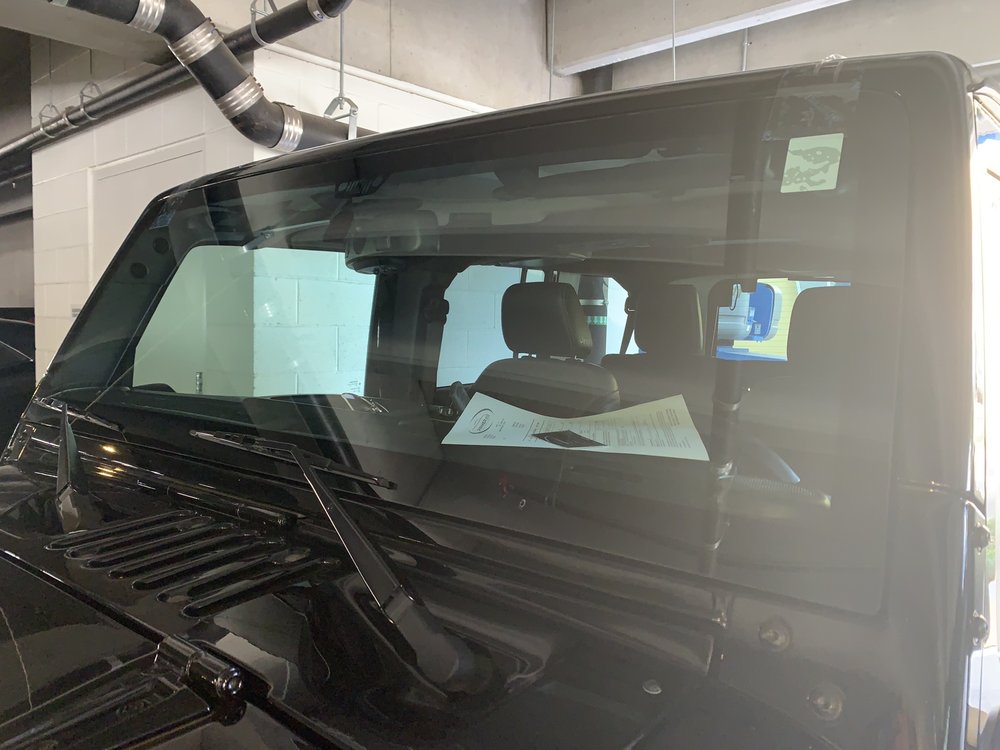 Auto Glass In Motion portfolio showcasing completed auto glass repairs on various vehicles
