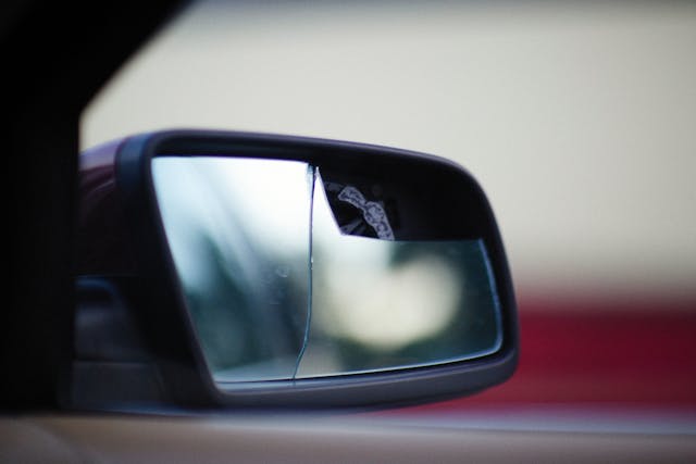 Replacing a damaged side mirror on a car